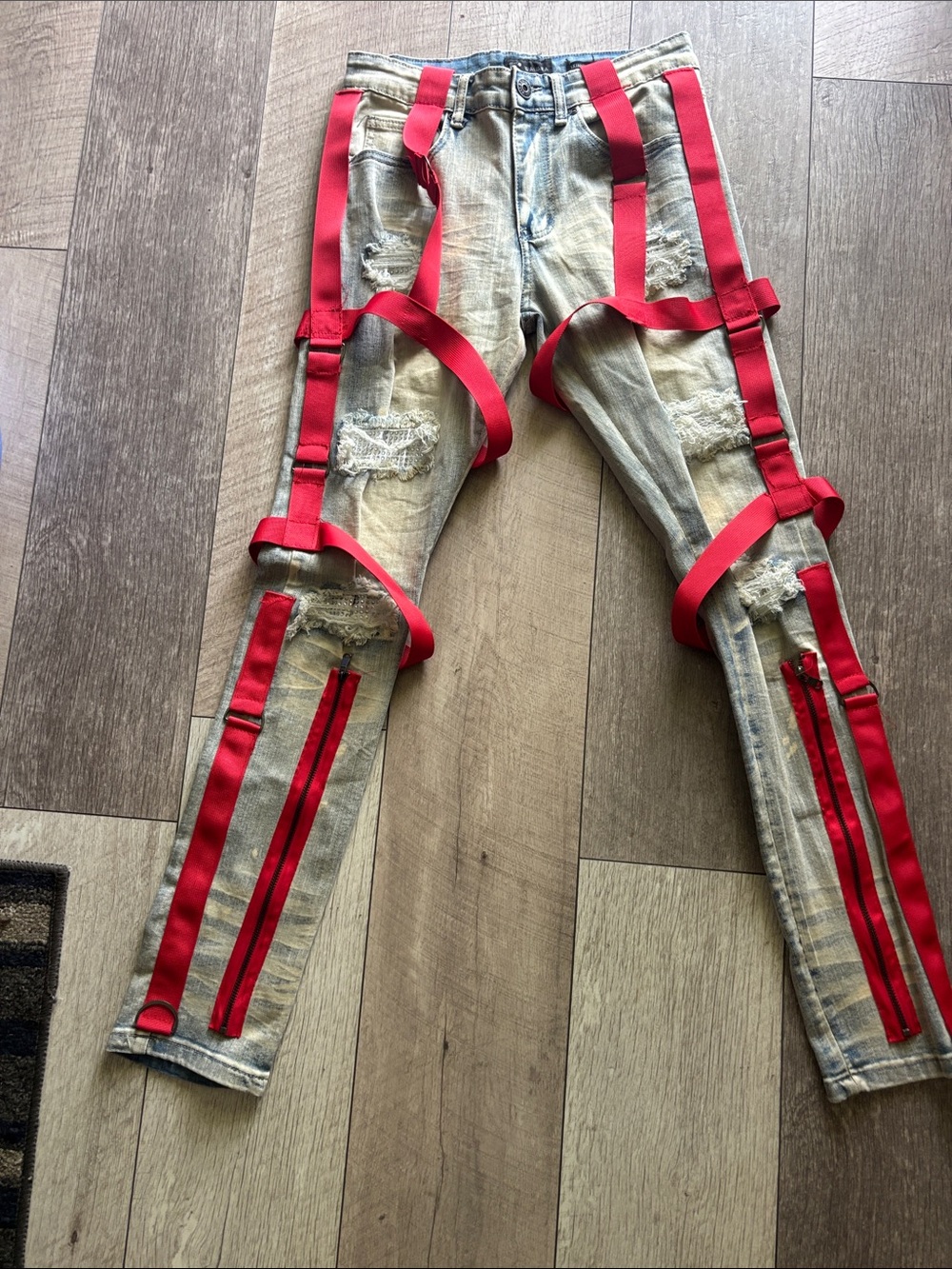 Men's Distressed Light Wash Jeans with Red Strap Details